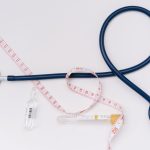 A stethoscope, ampoule, and tape measure on a white background symbolize healthcare essentials. — 3 Things You Need to Know a