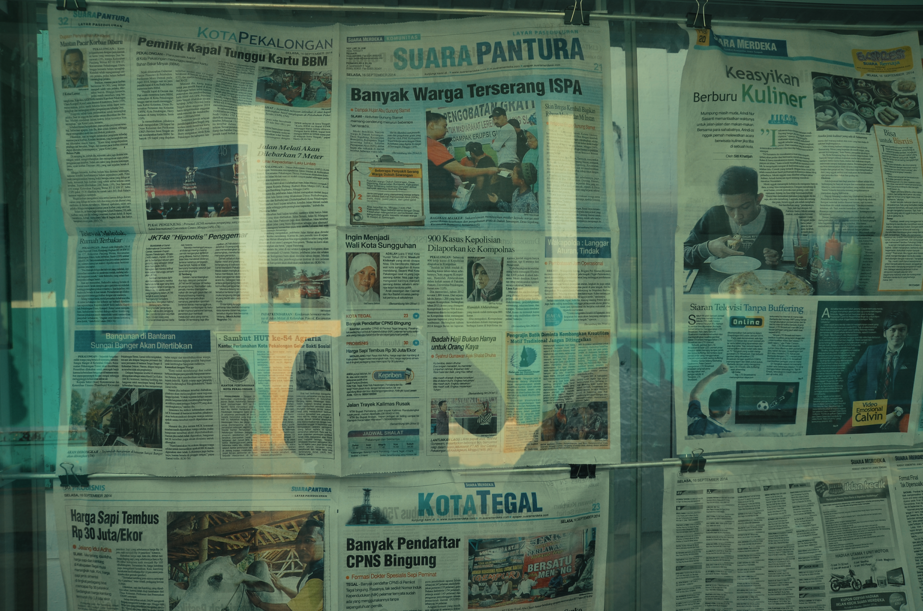 Detailed view of various newspapers on display in Jakarta, Indonesia. — 5 Indian apps for news you need to install now!