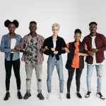 A diverse group of young adults united and holding hands, symbolizing solidarity and activism. — 5 Protective Bandeau Bras fo