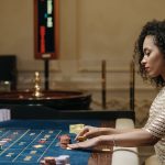 Stylish woman in a casino setting, playing roulette with stacks of chips. — Choosing the Private toto For A Safe Playground
