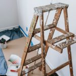 A messy stepladder and painting tools set up for a home interior renovation project. — Computerized Driveway Gates Price 2021