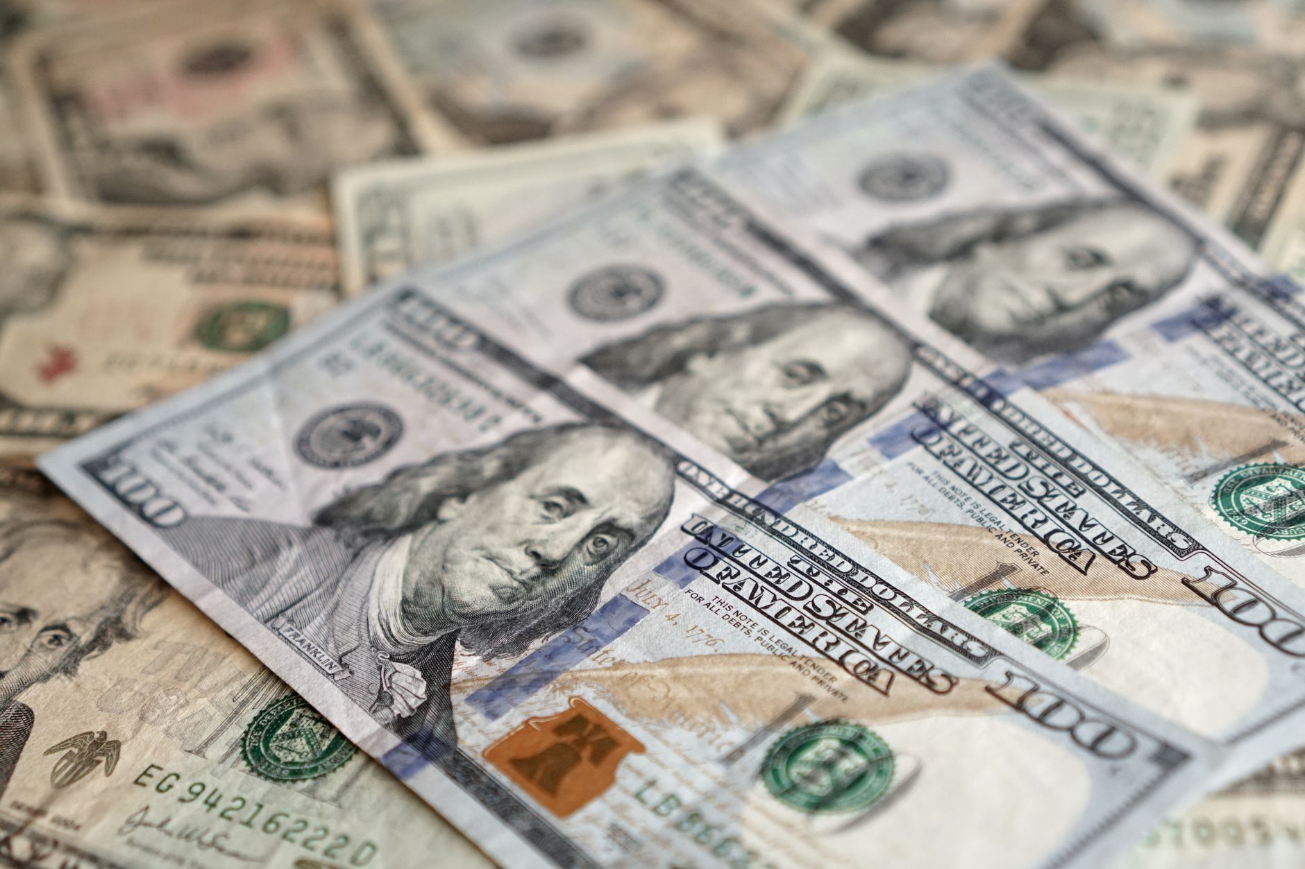 Detailed view of US dollar banknotes showcasing currency and investment themes. — Covered and Uncovered Interest Rate Parity