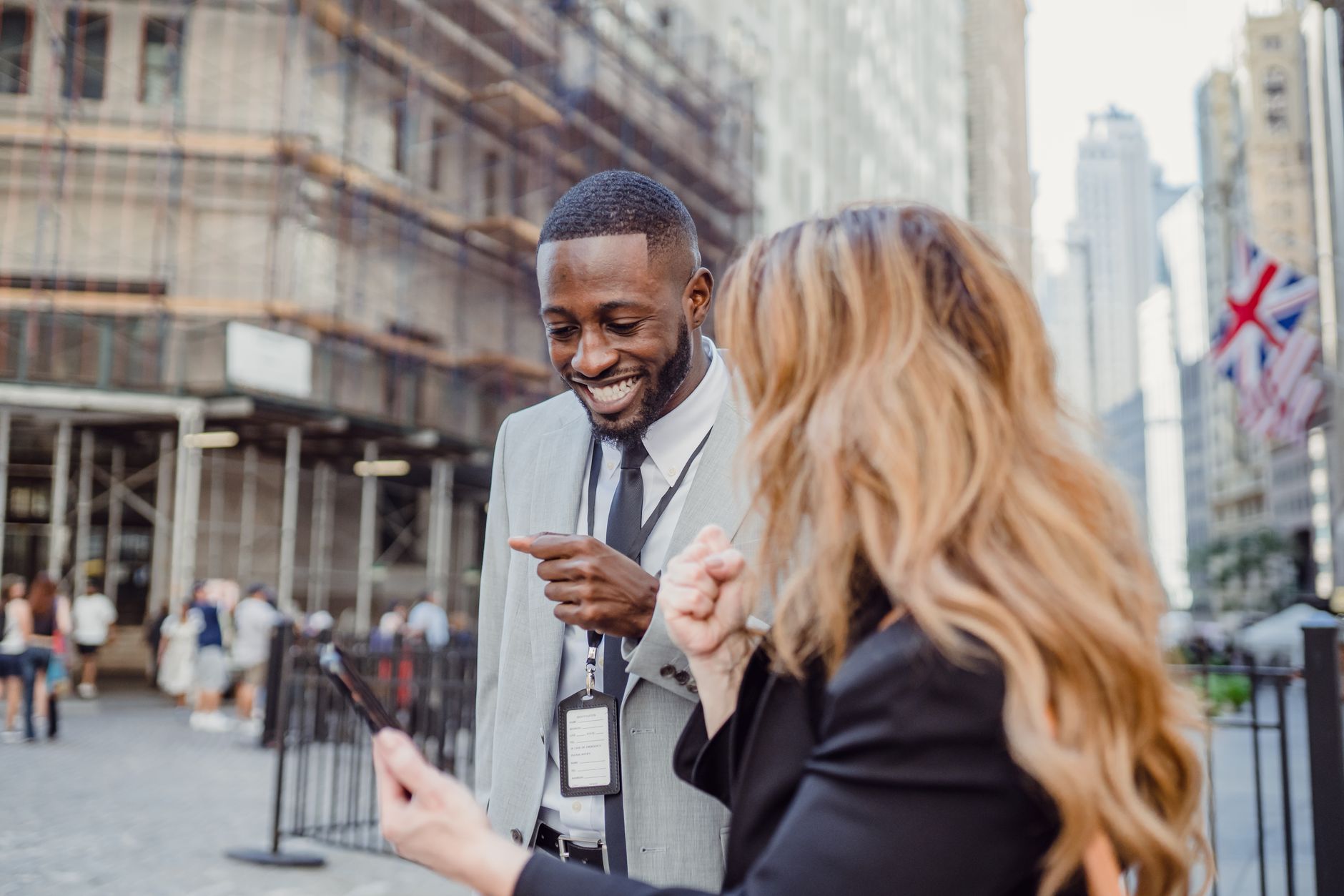 Two business professionals engage in lively conversation on an urban street, sharing insights. — Discover the Perfect Picnic