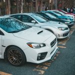 Vibrant lineup of parked cars in an outdoor lot, showcasing various models and colors. — Essential Tips for Preventing Auto G