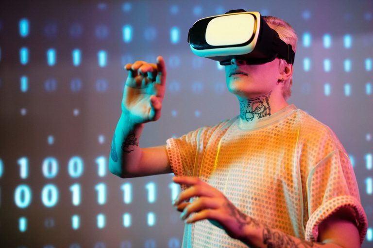 A young man interacts in virtual reality wearing a headset with a digital binary background. — Exploring the World of Gratis