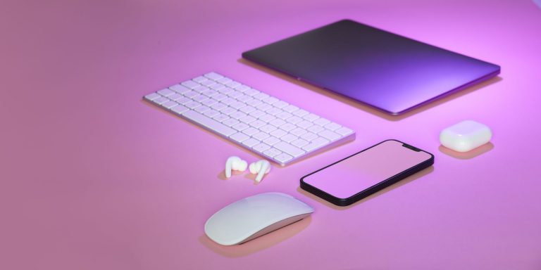 Flat lay of wireless tech gadgets on pink surface, highlighting modern electronics. — Finding Great Finishing Options For You