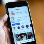 Close-up of a smartphone displaying an Instagram profile screen. — Get Ahead of the Game - Buy Instagram Followers Today