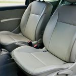 Spacious car interior featuring contemporary leather seats and a steering wheel. — Guide on hiring a credible house paint con