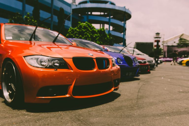 Close-up of vibrant sports cars parked outdoors, showcasing custom modifications and sleek designs. — Hiding Your Wires from