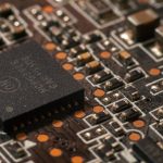 Detailed close-up of a computer circuit board showcasing electronic components. — How NAP XPS needs Essential with the Electr