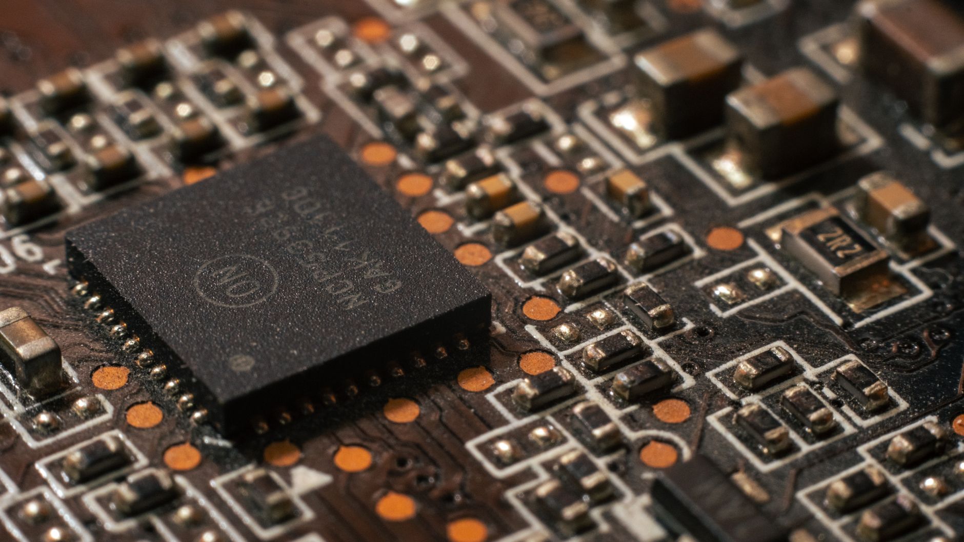 Detailed close-up of a computer circuit board showcasing electronic components. — How NAP XPS needs Essential with the Electr