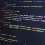 HTML and CSS code on a computer monitor, highlighting web development and programming. — How to boost internet speed