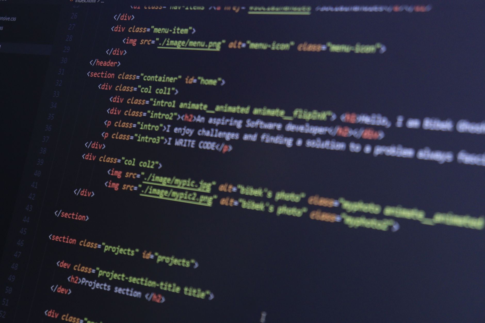 HTML and CSS code on a computer monitor, highlighting web development and programming. — How to boost internet speed
