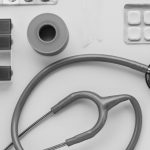 Top view of medical instruments and pills arranged on a white background. — How To Get Precaution From The Klonopin?