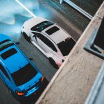 From above of modern automobiles with bright lights riding on asphalt road with marking lines at night — How To Protect Your