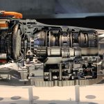 Detailed view of a car transmission cutaway, showcasing internal mechanisms. — How to Retouch Photos in Photoshop?