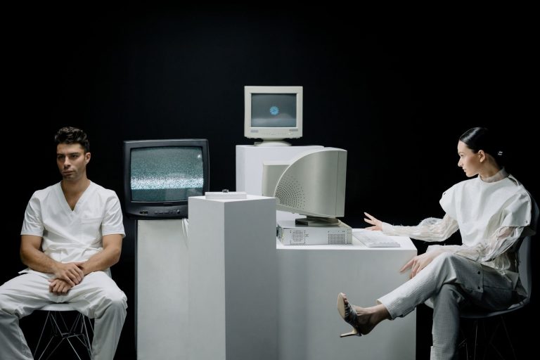 A modern depiction with vintage computers and individuals in a futuristic lab setting. — Is Your Business Compliant with Fire