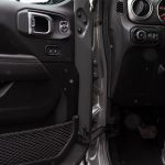Detailed interior shot of a car showing the door panel and part of the dashboard. — Let Us Buy Leather Shoulder Holsters!