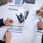 Business team analyzing financial charts and graphs during a collaborative meeting. — Making the Most of Your Medicare Advant