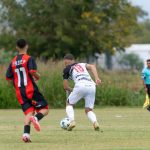 Two young soccer players competing during a match outdoors on a grassy field. — Online Cricket Betting: Free Tips To Win The