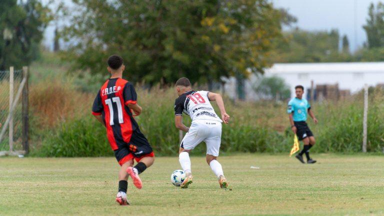 Two young soccer players competing during a match outdoors on a grassy field. — Online Cricket Betting: Free Tips To Win The