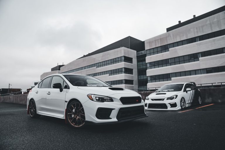 White sports cars showcased in a modern urban background, perfect for automotive enthusiasts. — Protect the car from dust and