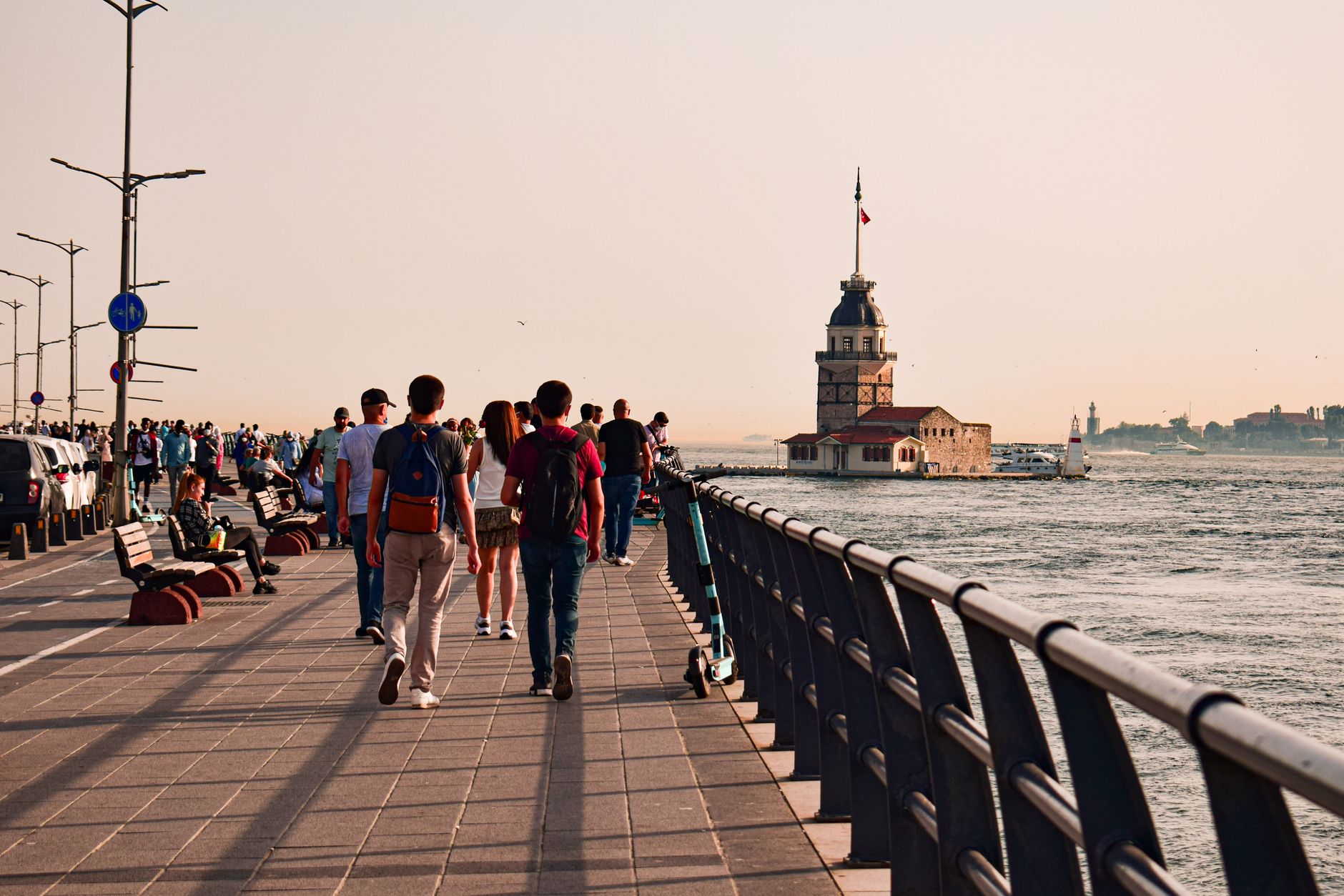 People walking along waterfront promenade in İstanbul with view of Maiden's Tower. — SIX best small towns to visit in Washing
