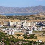 Stunning aerial photograph capturing the expansive cityscape of Elâzığ, Türkiye, with distant mountains. — Reconnecti