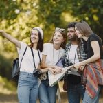 Young friends exploring a park with a map, smiling and enjoying the outdoors. — The Hotel Towels Buying Guide