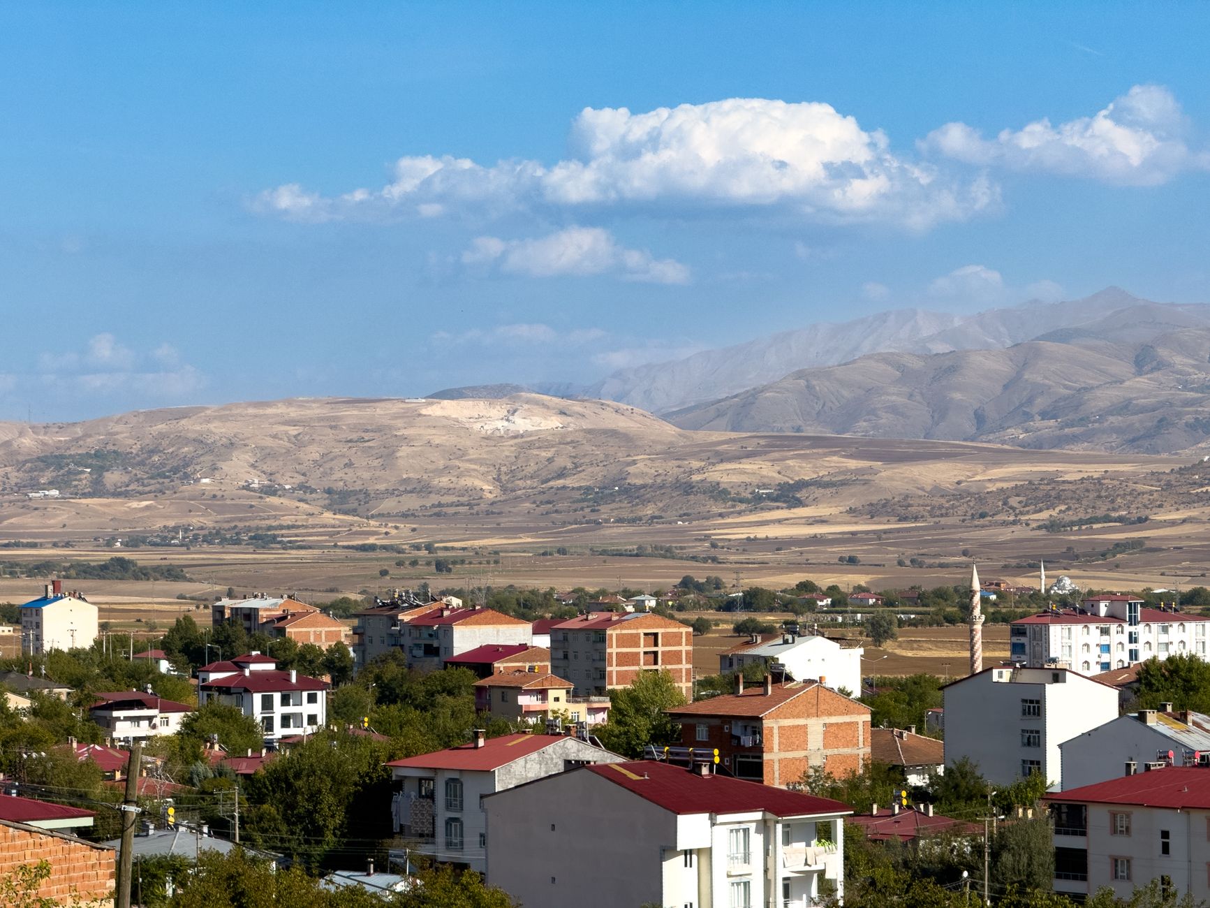 A picturesque view of Kovancılar, Elazığ with red-roofed houses and mountain landscape. — The Importance Of A University Degr