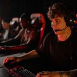 A dedicated team of young gamers engaging in a competitive esports tournament. — The rules and gameplay of Domino QQ revealed