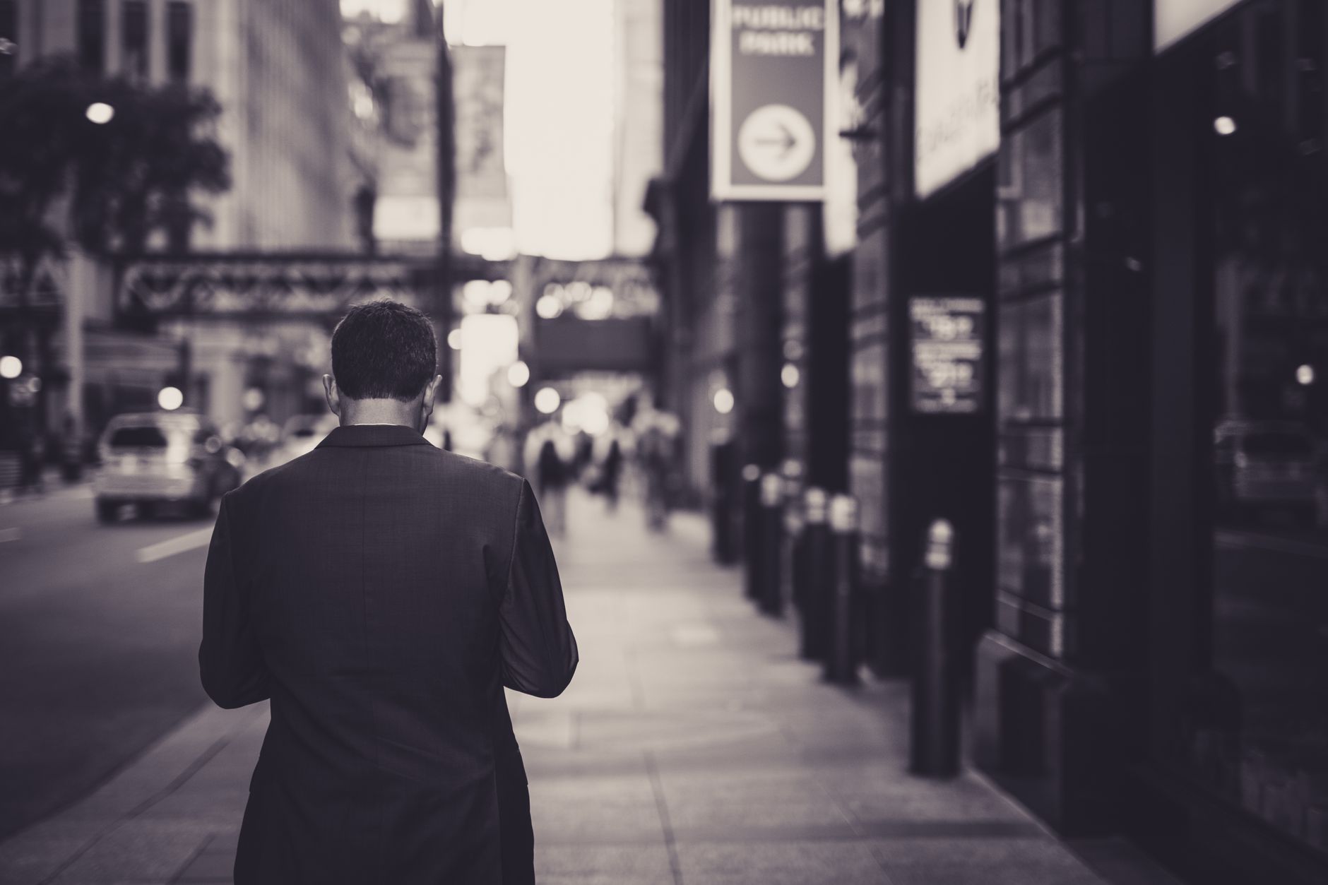 Man in a suit walking down a city street in a lonely, urban setting. — Tips And Tricks To Select The Best Printing Services