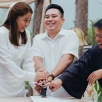 Happy couple with registrar stamping wedding document outdoors, celebrating marriage. — Tips For Chicago Party Bus Rentals