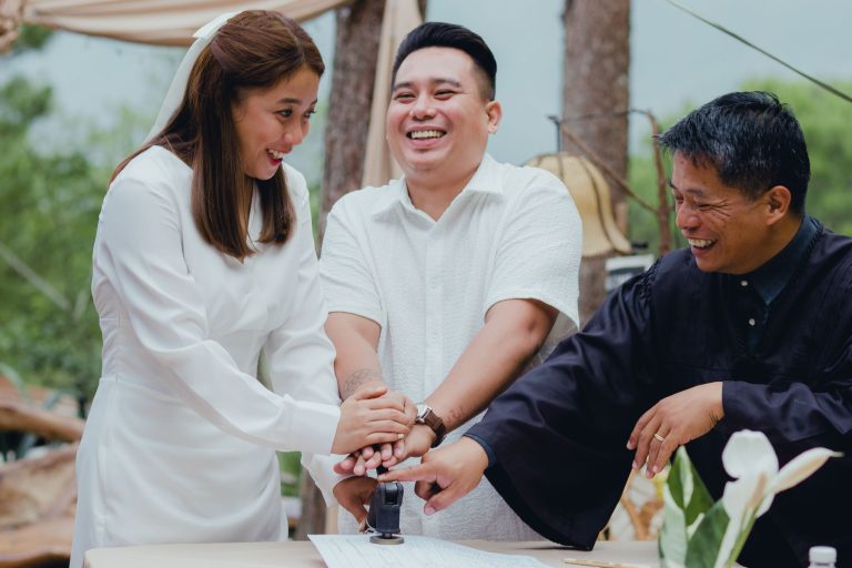 Happy couple with registrar stamping wedding document outdoors, celebrating marriage. — Tips For Chicago Party Bus Rentals