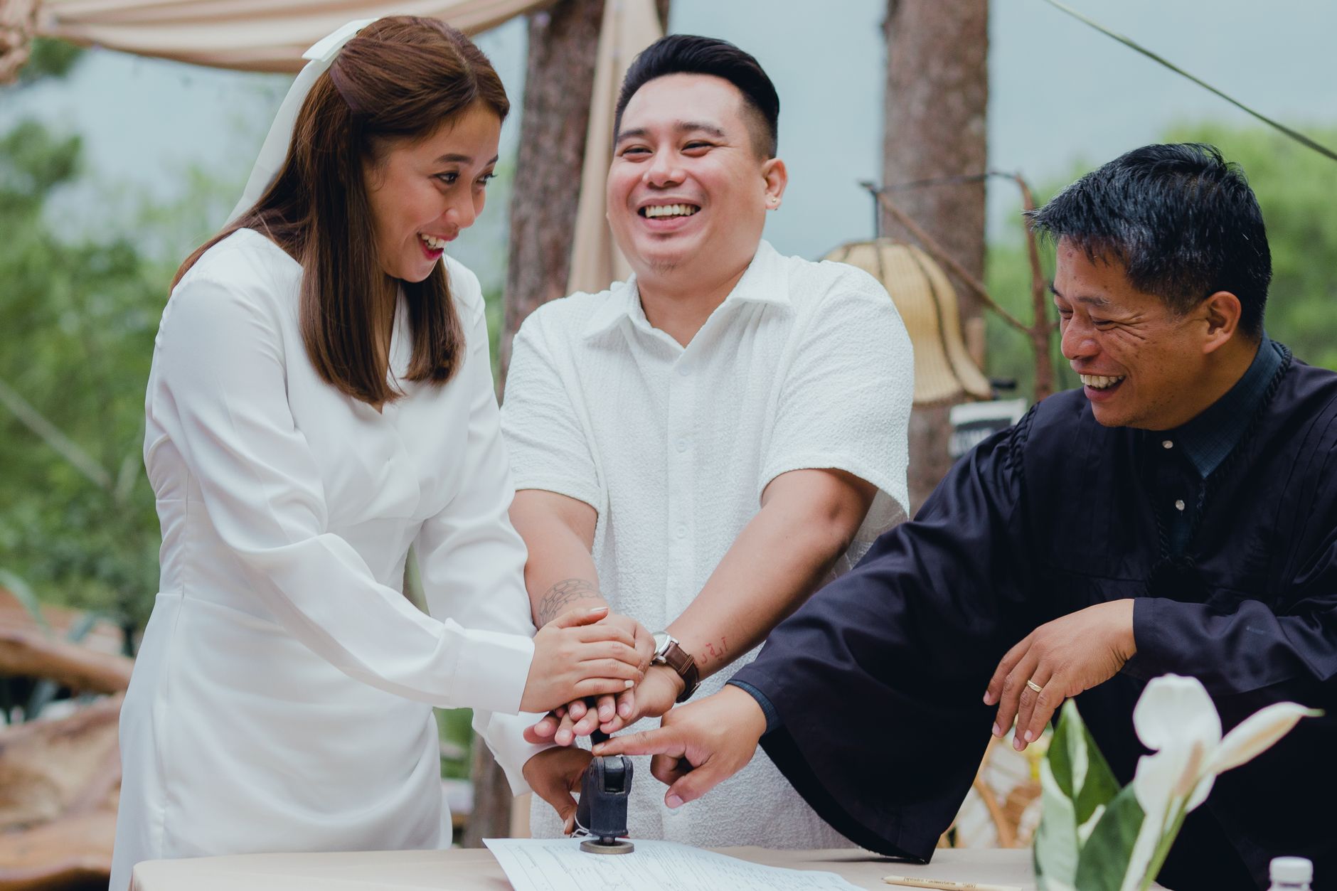 Happy couple with registrar stamping wedding document outdoors, celebrating marriage. — Tips For Chicago Party Bus Rentals