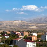 A picturesque view of Kovancılar, Elazığ with red-roofed houses and mountain landscape. — Tips for Finding the marijuana deli