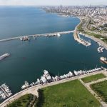 Aerial shot of a marina with yachts in Istanbul, Turkey, showcasing the skyline and sea. — Treat Your Pet With Better Care Wi