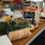 A delicious gourmet cheese platter featuring Brie cheese, crackers, and charcuterie. — Turkish Cuisine: Mouthwatering and Nut