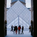 Tourists explore the stunning Louvre Pyramid in Paris, a famed architectural landmark. — Two-person fishing kayaks advantage