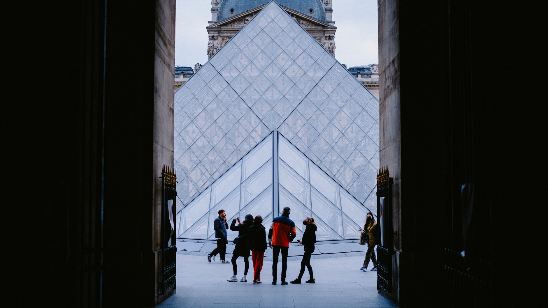 Tourists explore the stunning Louvre Pyramid in Paris, a famed architectural landmark. — Two-person fishing kayaks advantage