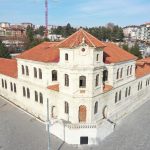 Aerial view of a historic stone building with red tile roofs in Sivas, Turkey, on a sunny day. — Understanding The Advantages