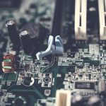 Detailed view of components on a computer motherboard, showcasing technology and circuitry. — Ways to Improve Security
