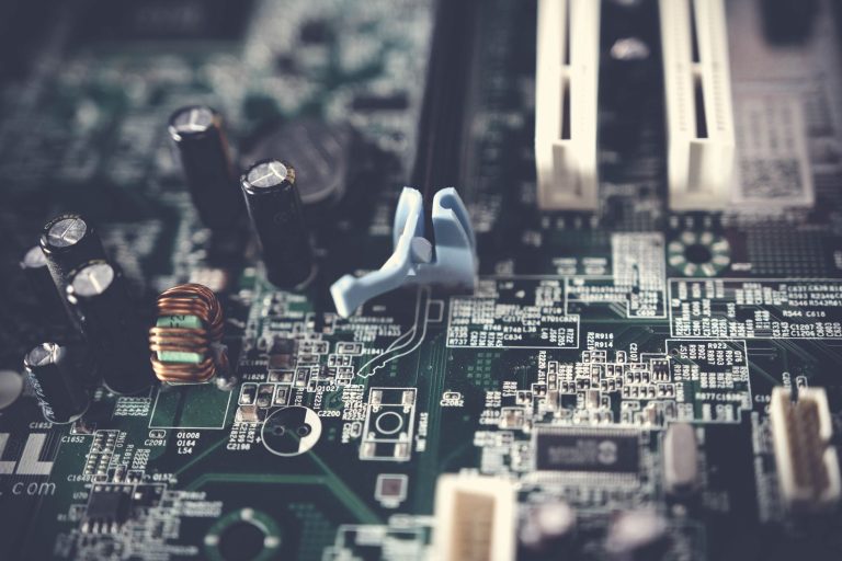 Detailed view of components on a computer motherboard, showcasing technology and circuitry. — Ways to Improve Security