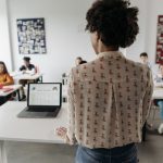 Female teacher engaging students in a classroom setting with diverse learners. — What Kind Of Courses Are Helpful In Getting