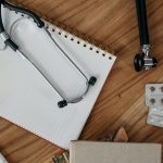 Flat lay of medical tools and supplies on a wooden desk surface. — What mistakes should be avoided by the elders and how the