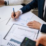 Professionals analyzing financial charts in a corporate setting. — What You Need to Know About Arlington's Best Locksmith