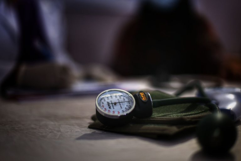 Detailed image of a medical sphygmomanometer on a table, indicating health check-up setting. — Why You Need To Learn Nutritio