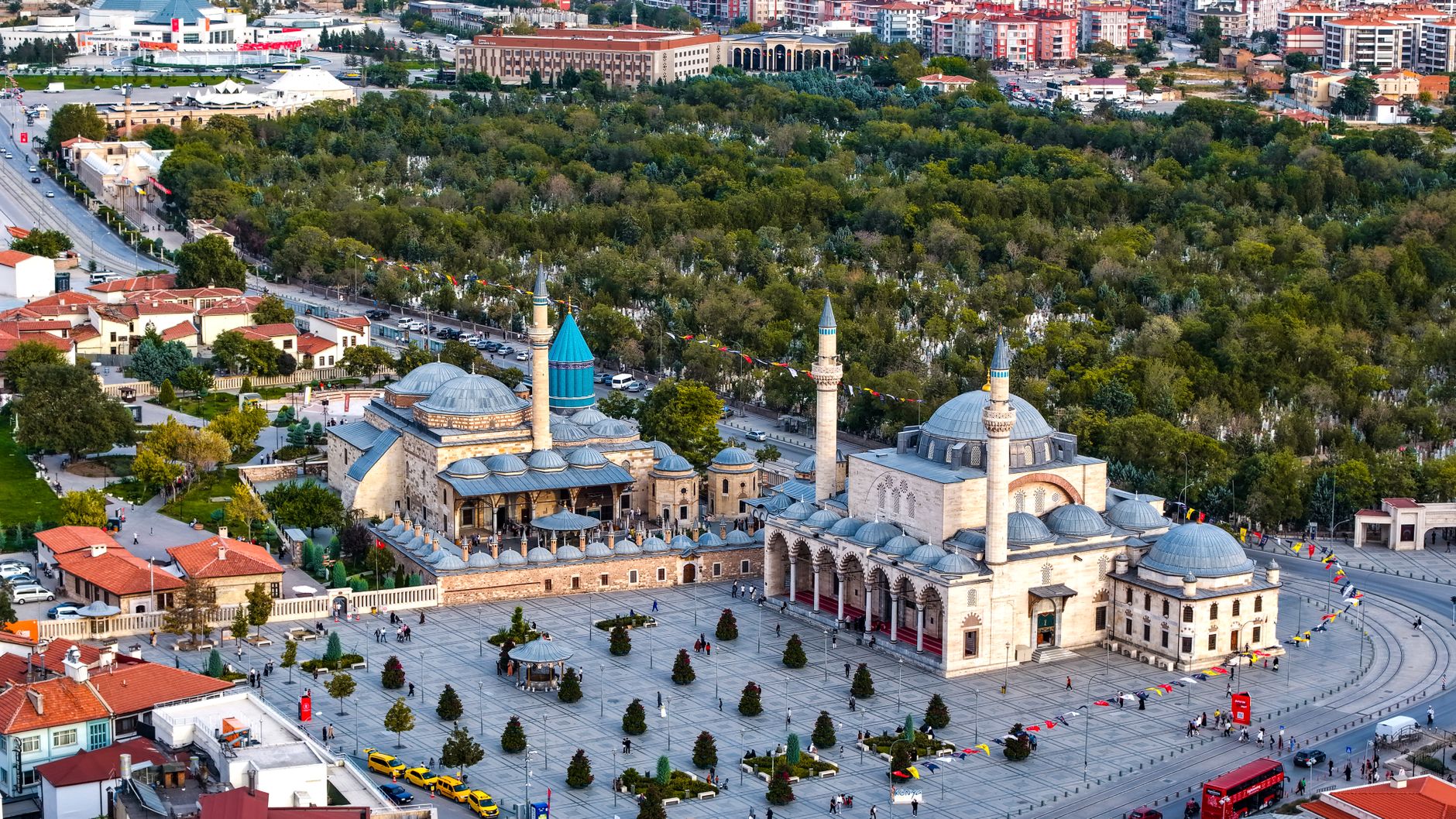Vibrant aerial view of the iconic Mevlana Museum located in Konya, Türkiye, surrounded by lush greenery. — Your Love Life Is